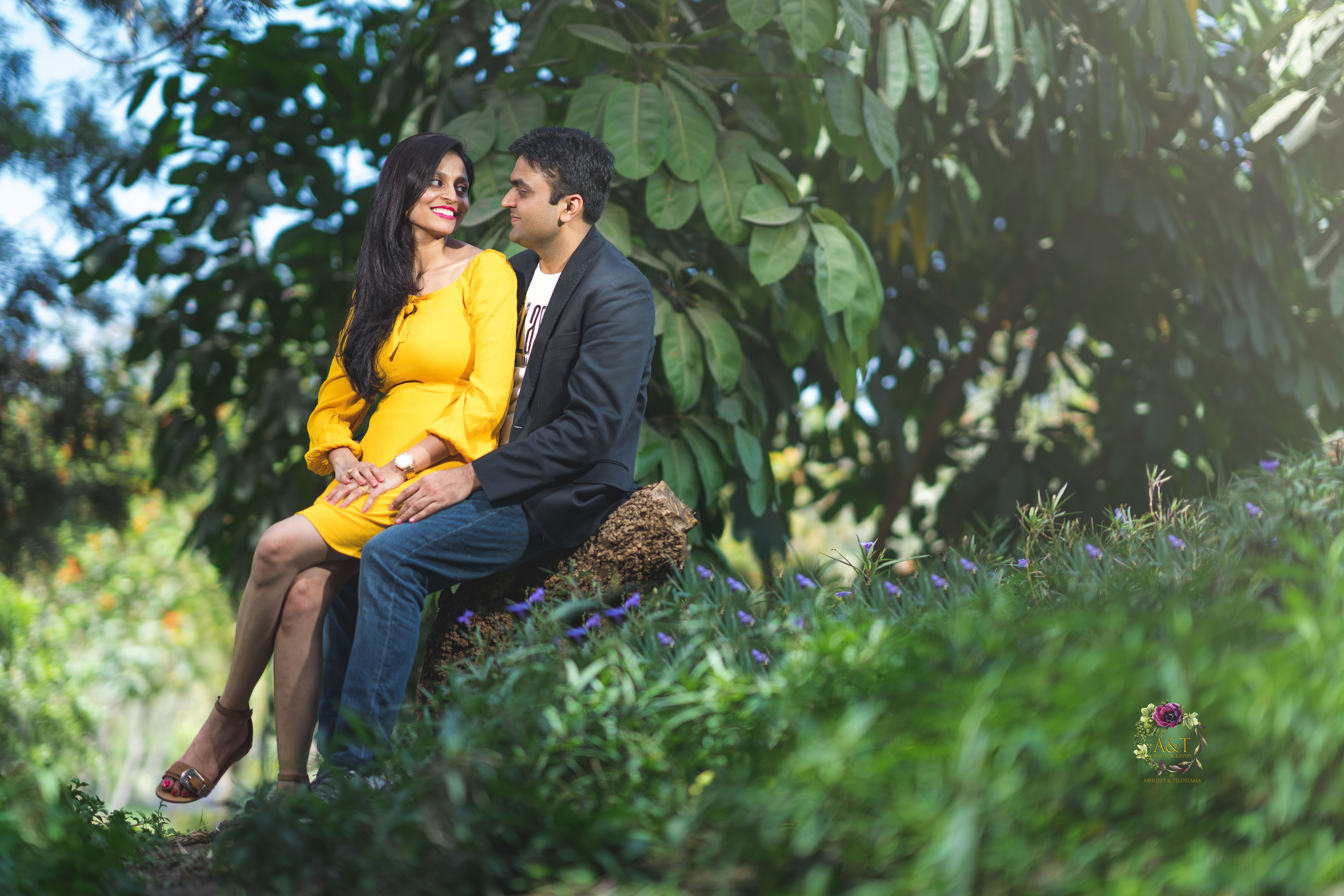 Adorable Couple seating on a rock in forest for their Pre-wedding Phototshoot in Pune. 
