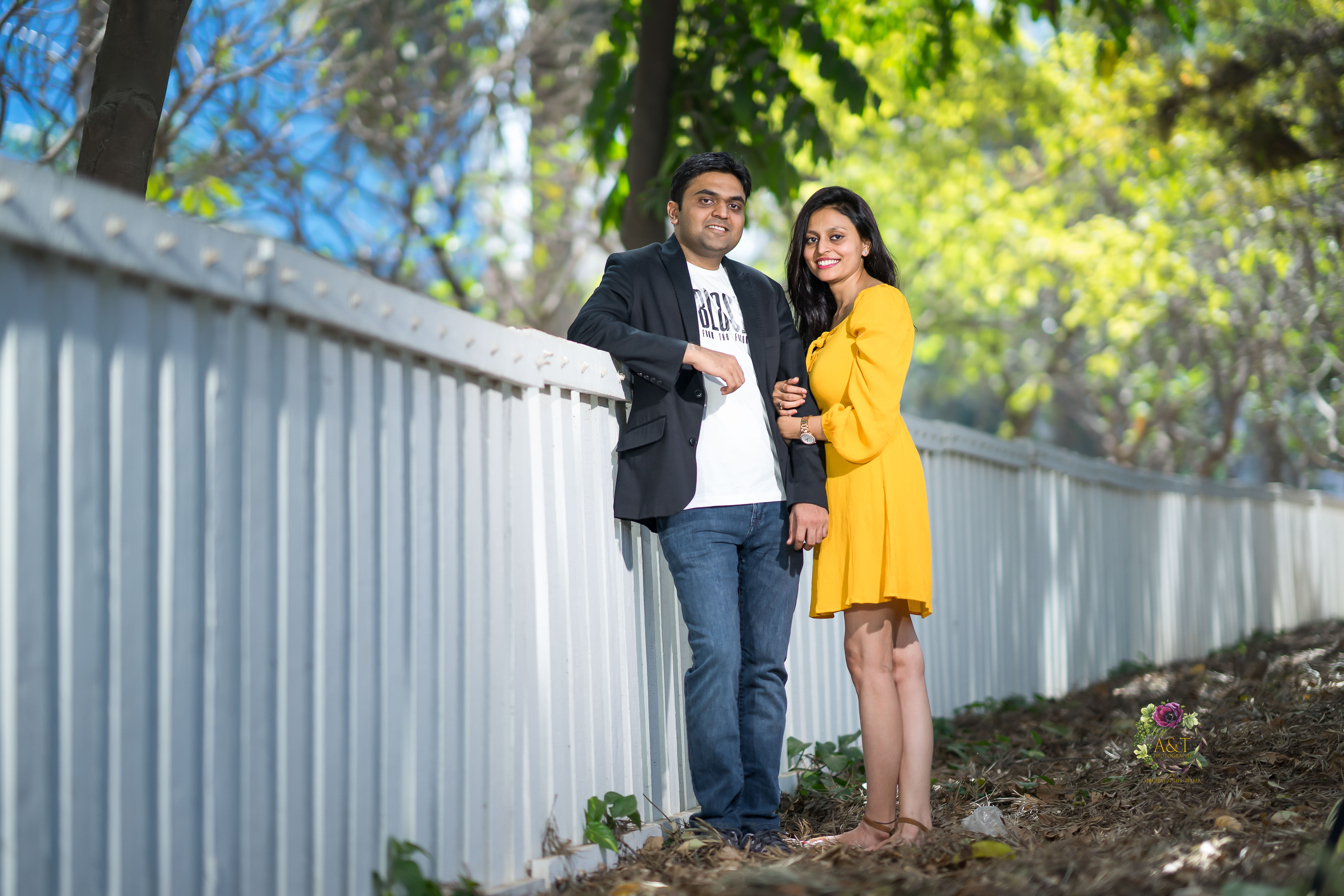 Priyanka & Swijal standing near a white compound wall of Aditi Garden and giving pose for their best pre-wedding photoshoot in Pune