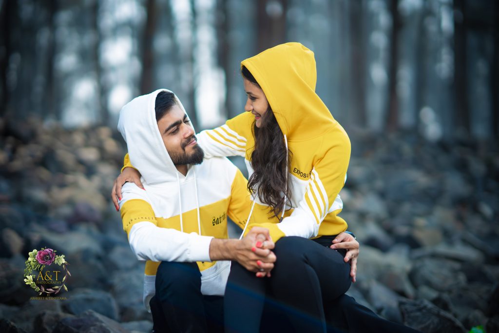 Matching hoodies for pre-wedding are excellent choice of costumes suggested by destination wedding photographer in Pune