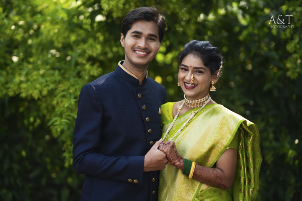 Best Wedding Photographer in Pune Captured this amazing portrait of a couple smiling at lush green background